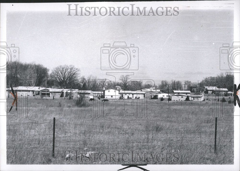 1969 Houses with horses in the field - Historic Images