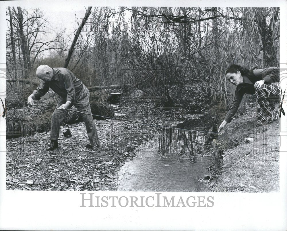 1974 Man works on drain project in Franklin - Historic Images