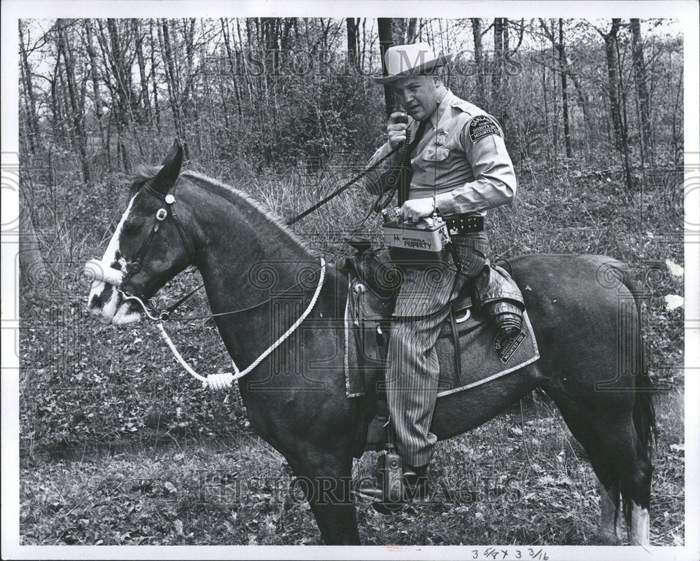 1960 Officer on horseback w/ walkie-talkie - Historic Images