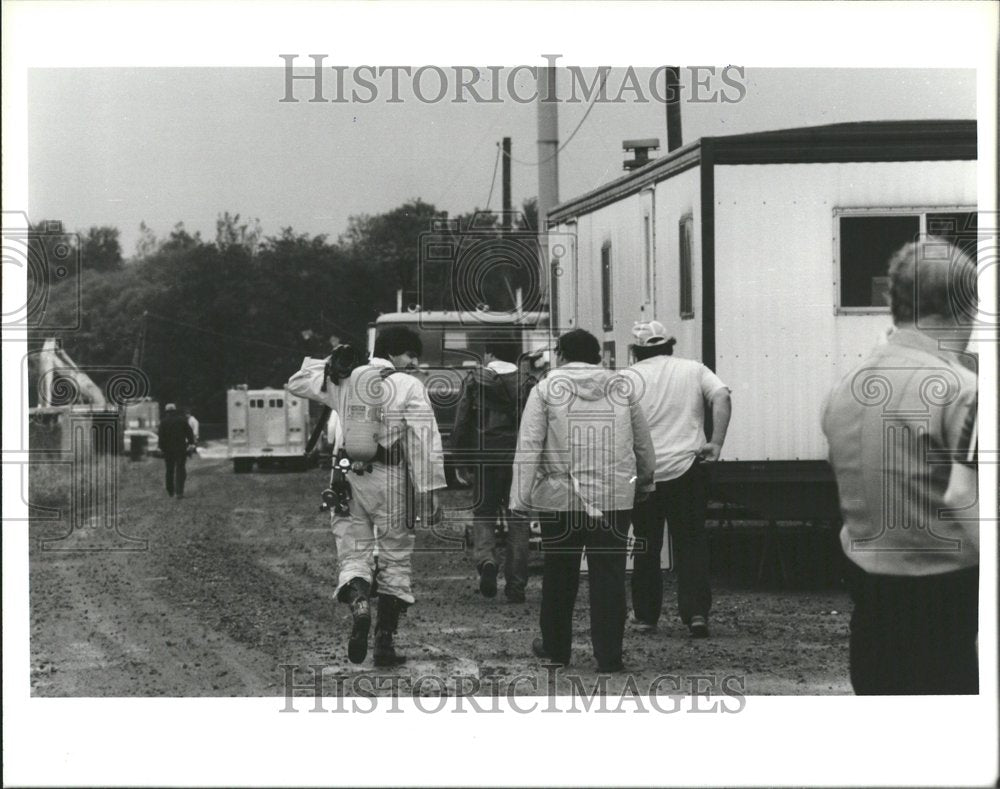 1983 Fire fighters coming out - Historic Images