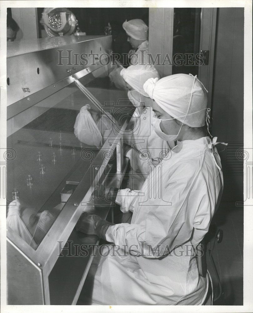 1953 Factory Workers Put Stoppers in Bottle - Historic Images