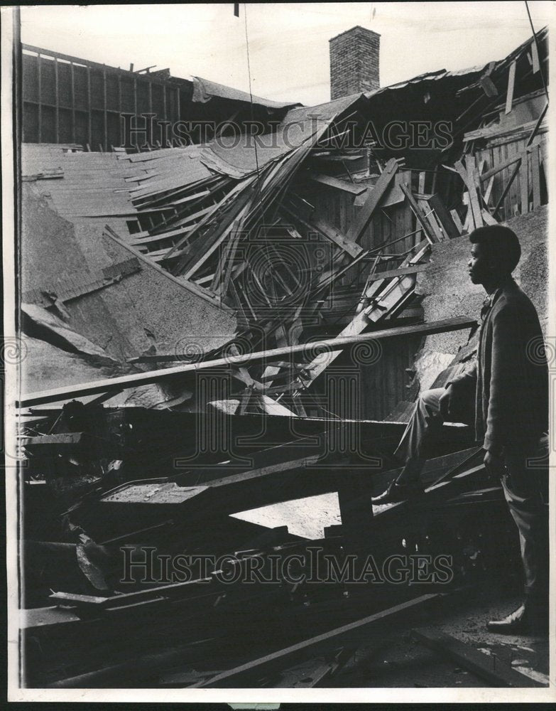 1958 Man Looks at Caved In Gym Rubble - Historic Images