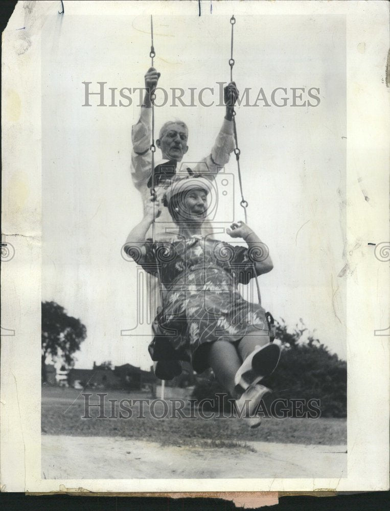 1966 Elderly Couple Swinging Through Life - Historic Images