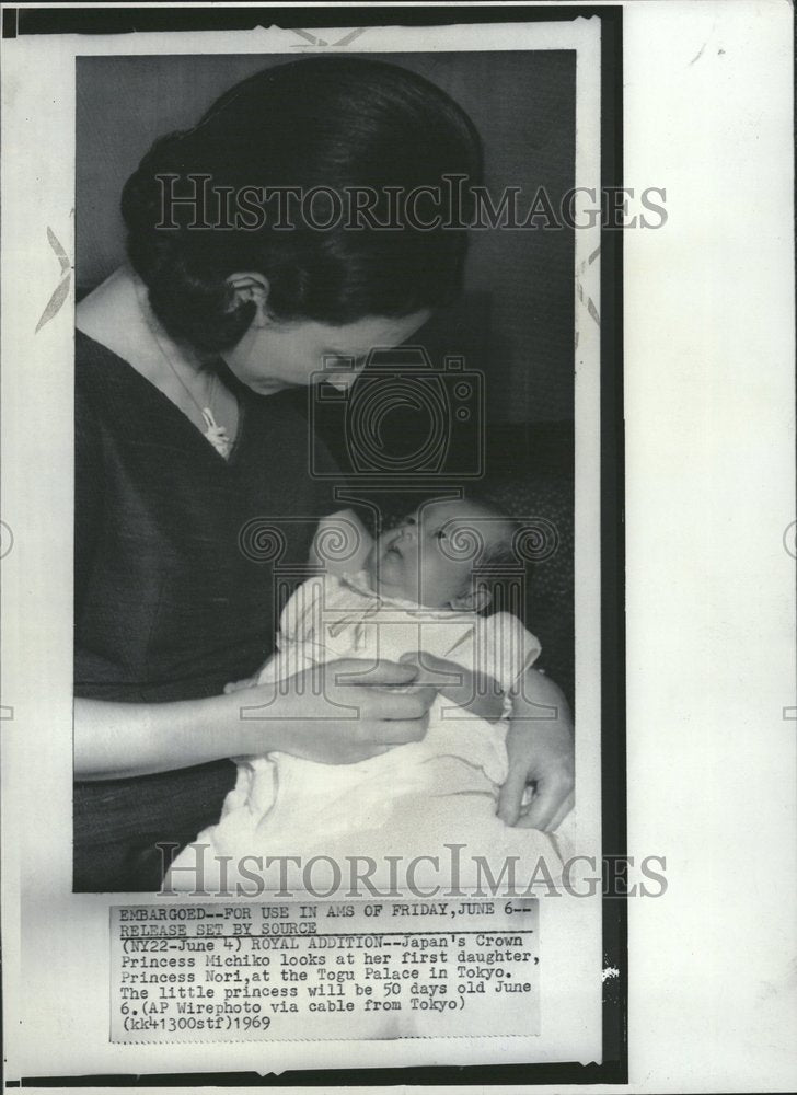 1969 Princess Michiko looks at her 1st girl - Historic Images