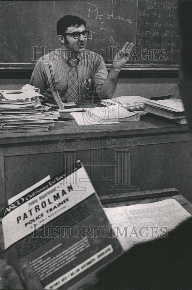 1970 Teacher instructs police exam class-Historic Images