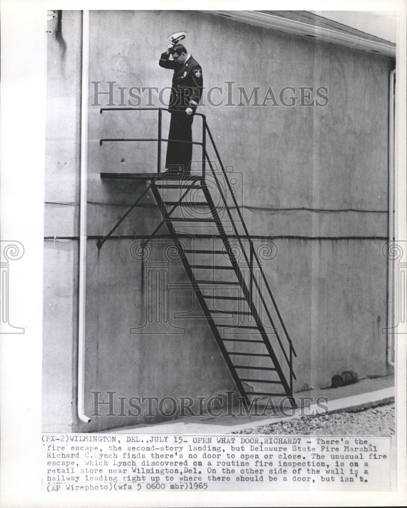 1965 Fire escape is missing a door - Historic Images