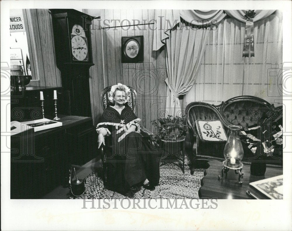 Costumed Old Woman Sits With Antique Furniture - Historic Images