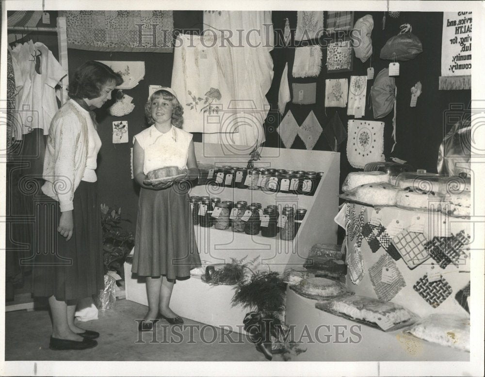 1955 Young Girl Peddles Food Crafts at Fair - Historic Images