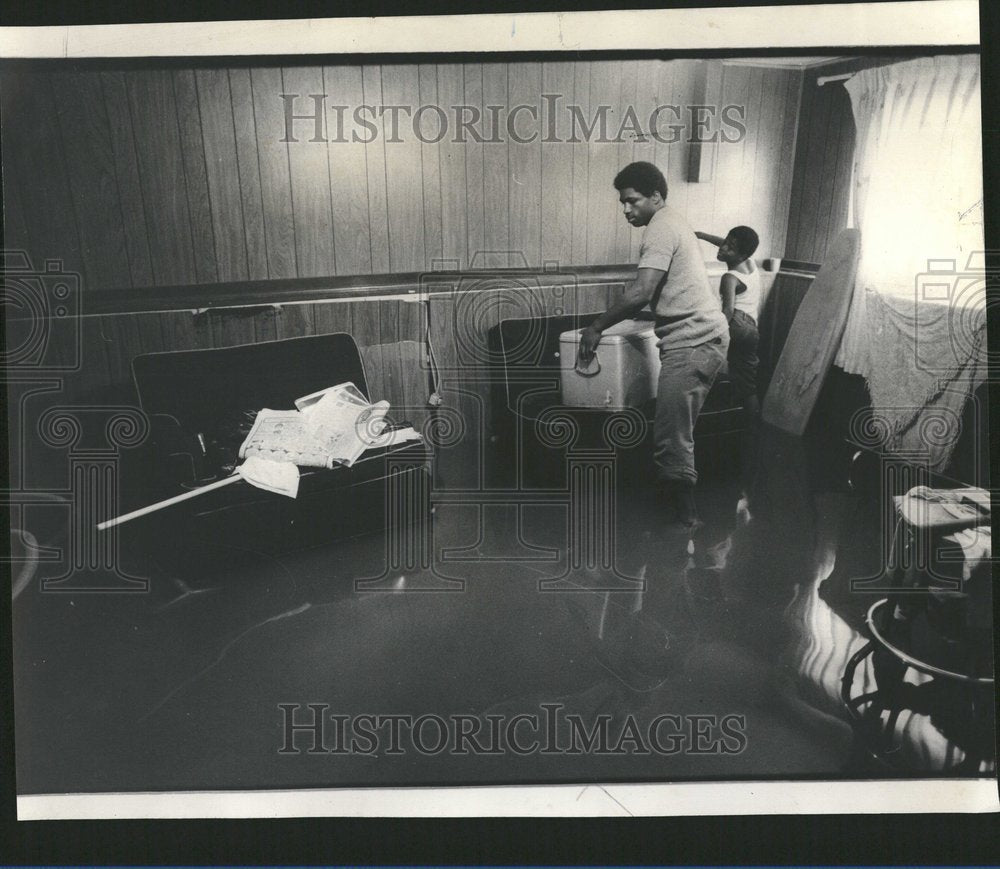 1974 Dwayne McDowell In Flooded Family Room - Historic Images