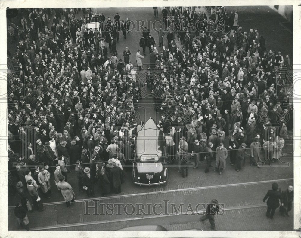 1941 Strikers try to overturn an automobile - Historic Images