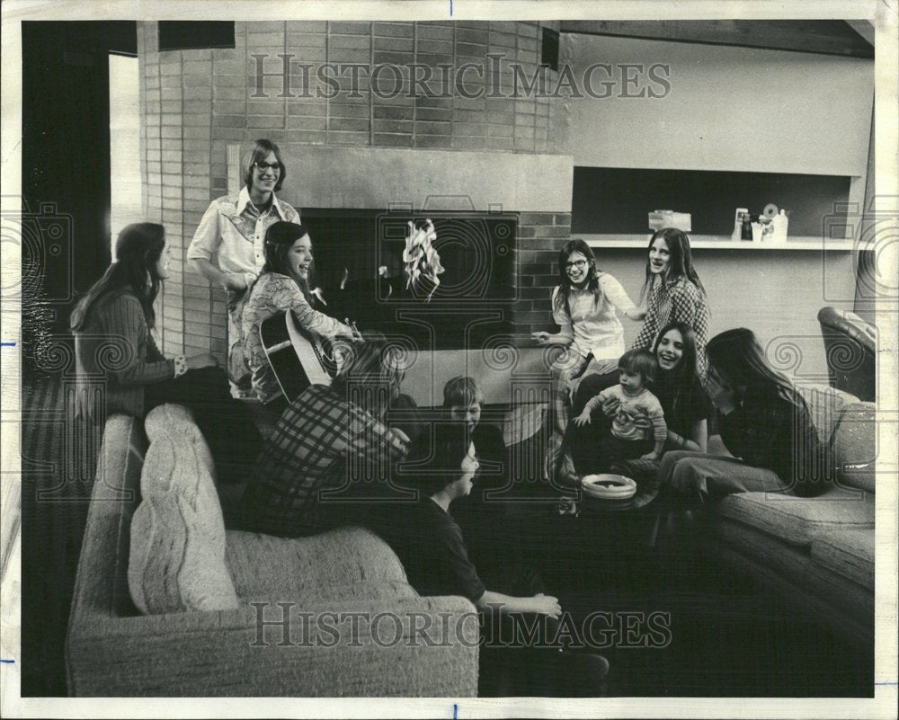 1975 Young people gather in condo clubhouse - Historic Images