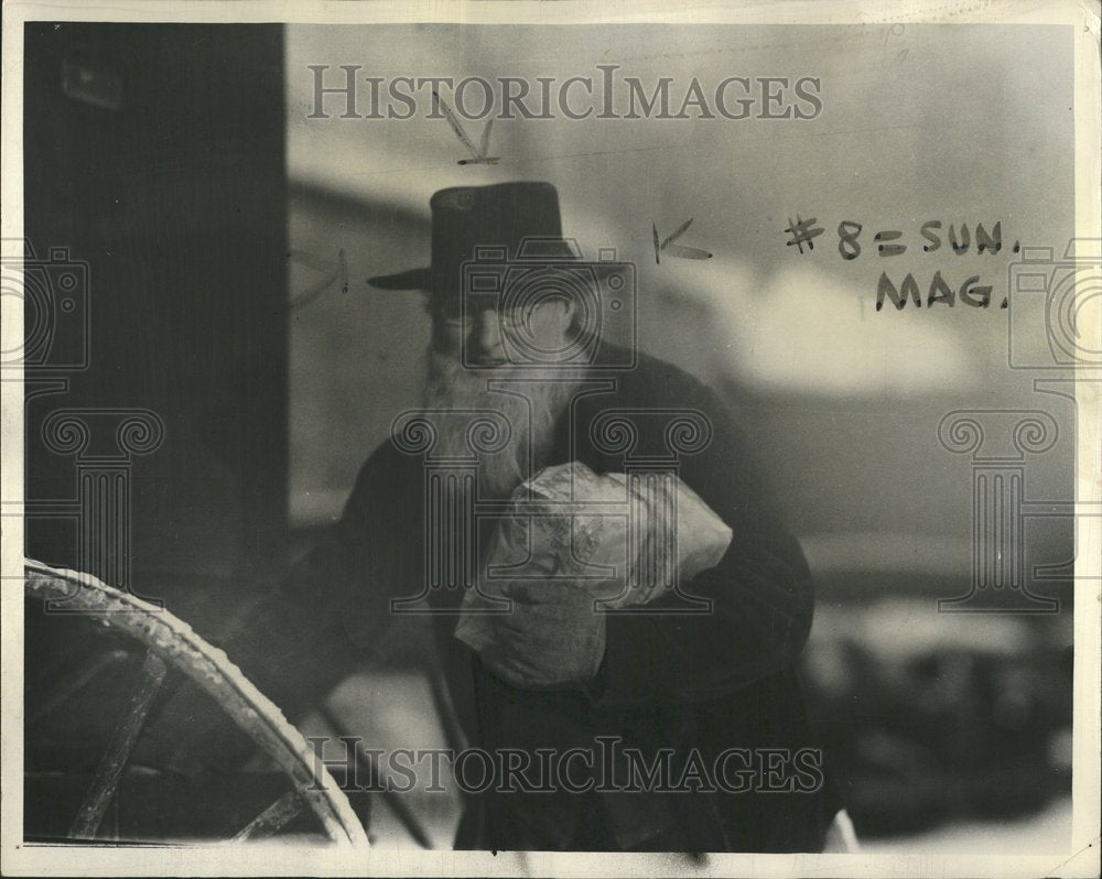 1972 Amish Man Carrying Package - Historic Images