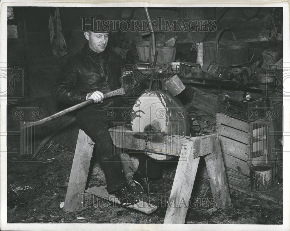 1938 Man Sharpening Ax On Grindstone - Historic Images