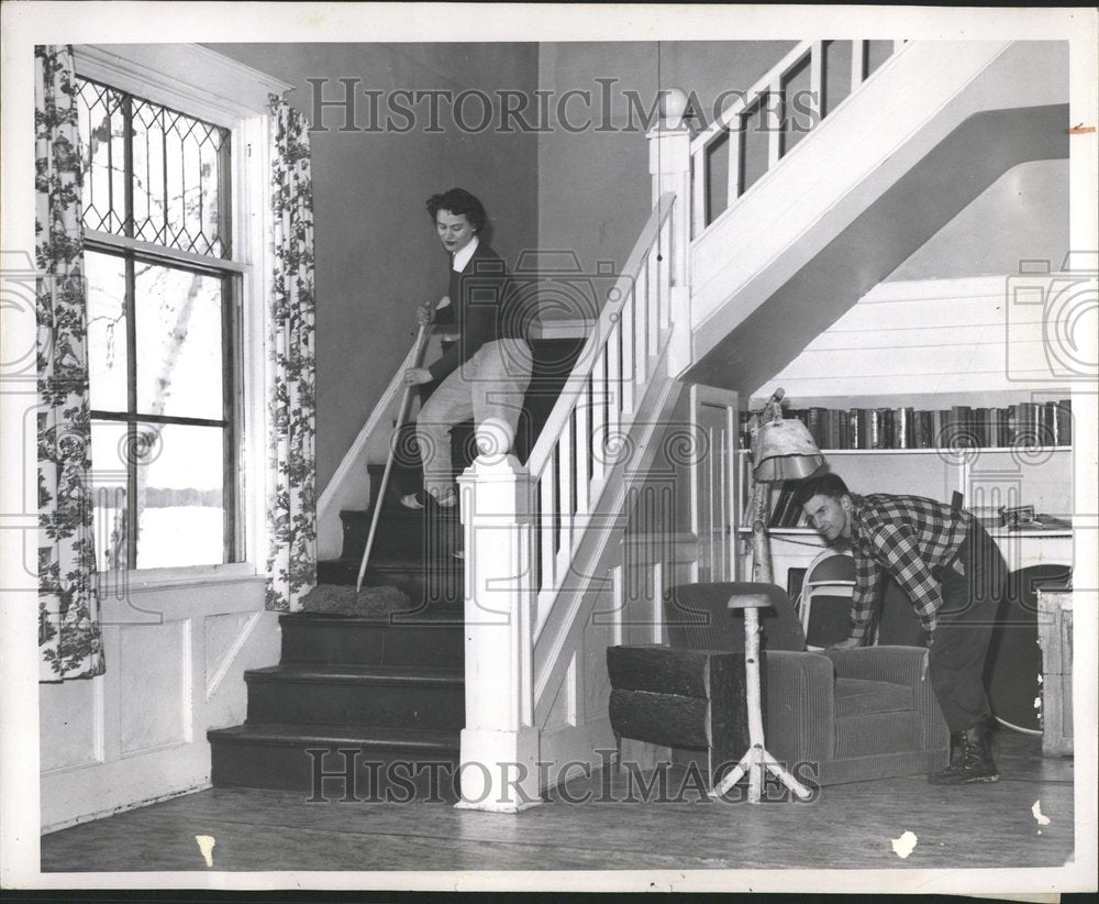 1950 Young Couple Happily Cleaning House - Historic Images