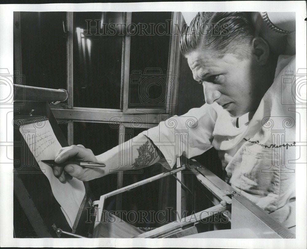 1956 Veteran Using Gravity Defying Pen - Historic Images