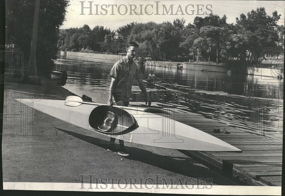 1960 Theis carries kanot to the water - Historic Images