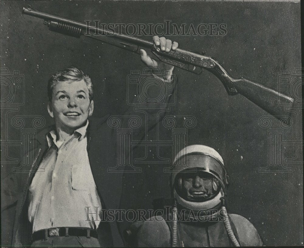 1967 Kid holding a Daisy pump gun - Historic Images