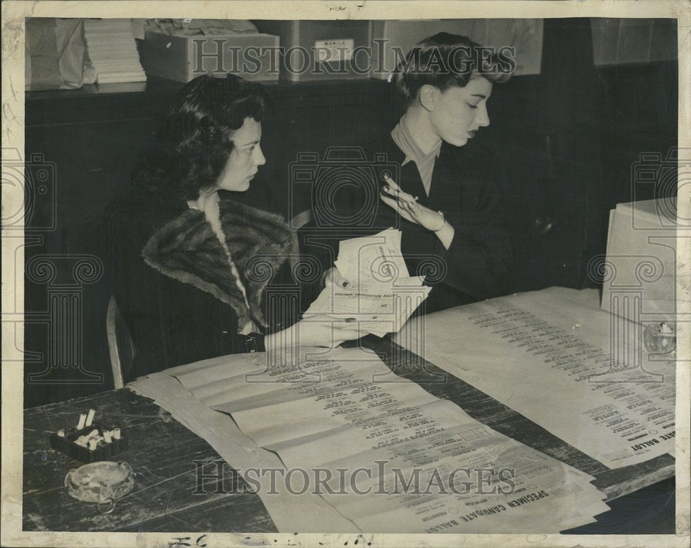 1946 Tired poll place workers, toss ballots - Historic Images