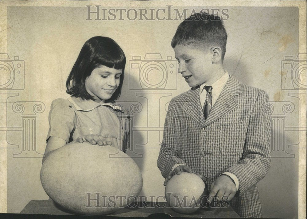 1952 Comparing Giant Egg With Ordinary Egg - Historic Images