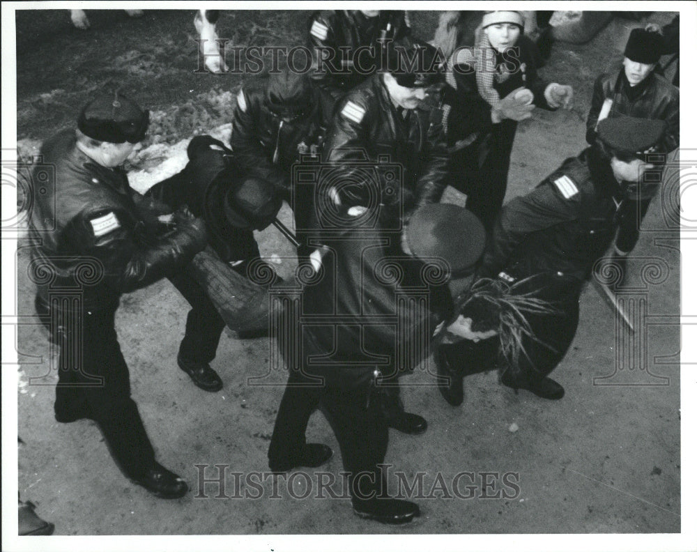 1991 demonstrator carried away after arrest - Historic Images