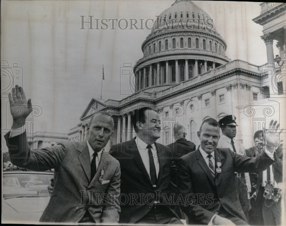 1965 Astronauts wave from car- space travel - Historic Images