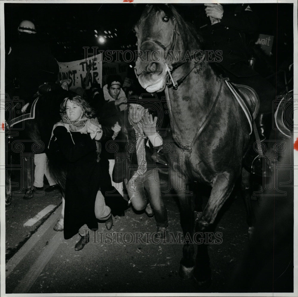 1991 Anti-war marchers break police line - Historic Images