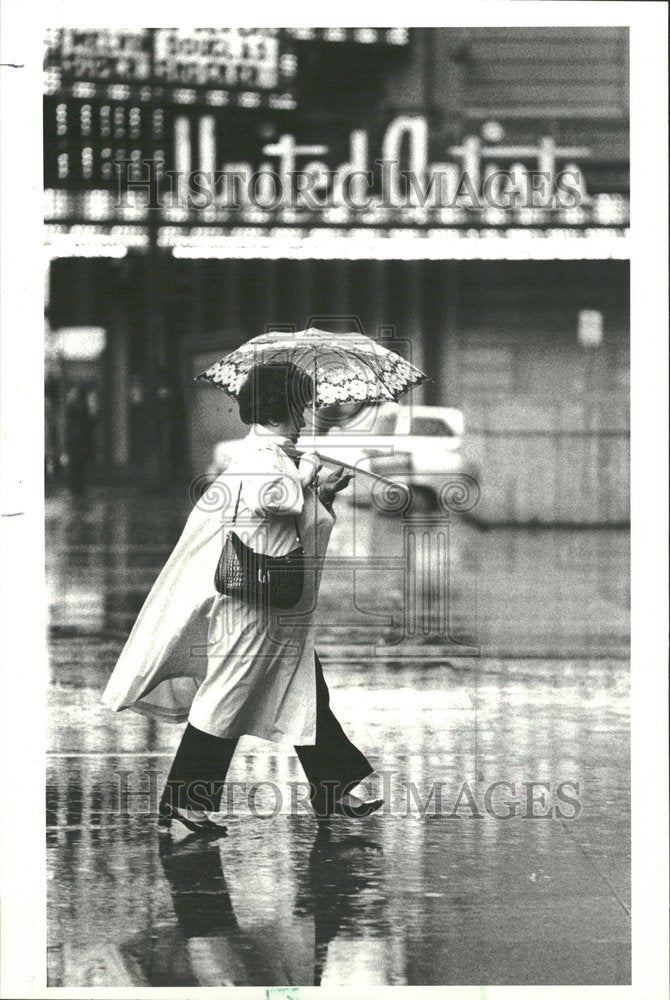 1980 A Woman Walking In The Chicago Rain - Historic Images