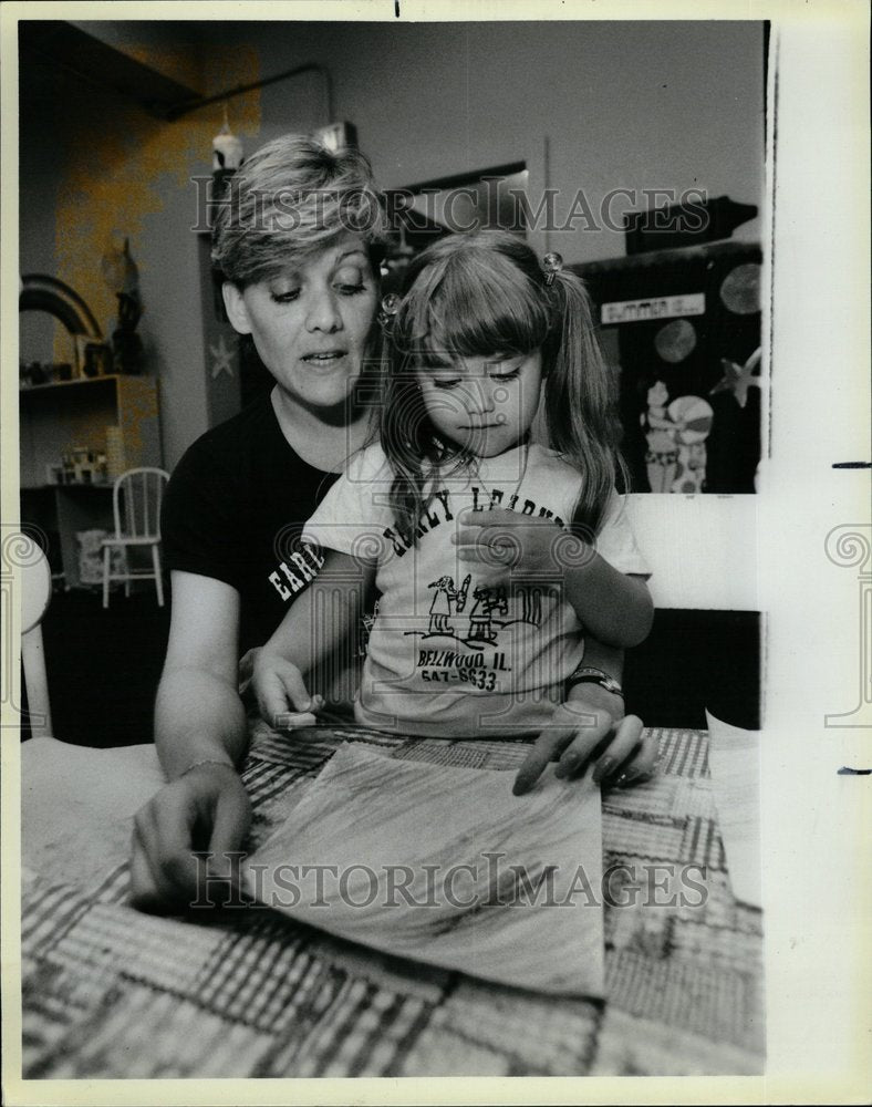 1985 Preschool Educator Works With Student - Historic Images