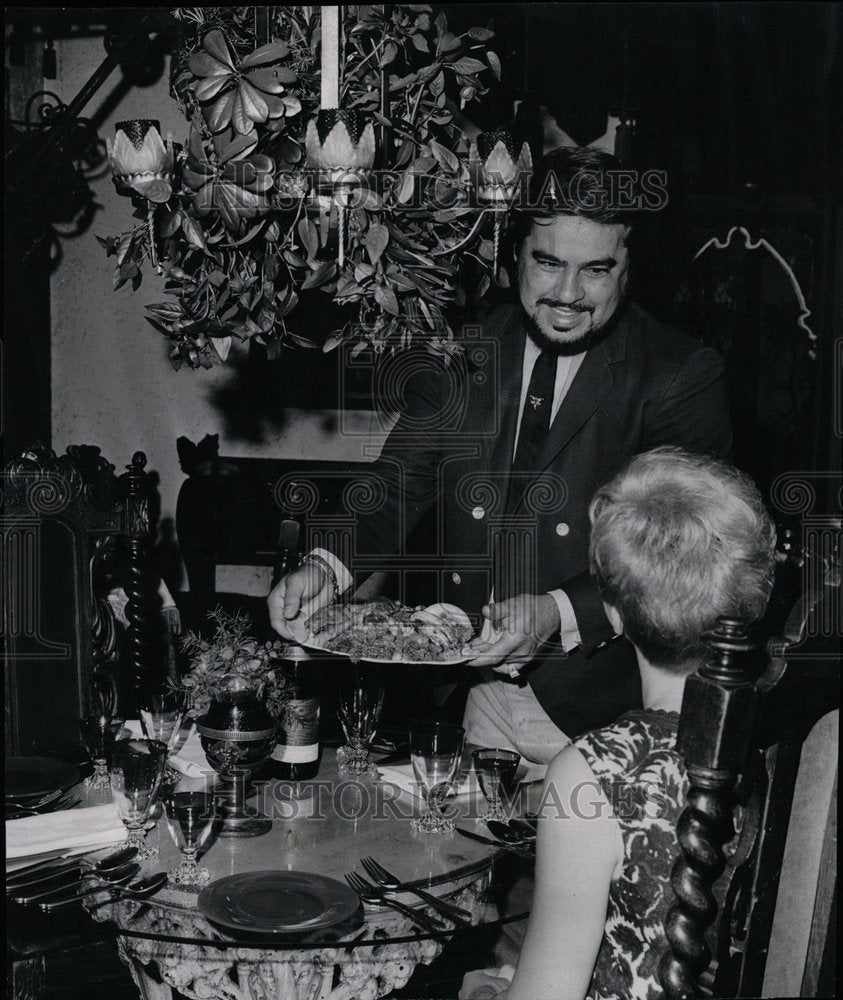 1967 Chief Archie Pina serves elegant meal - Historic Images