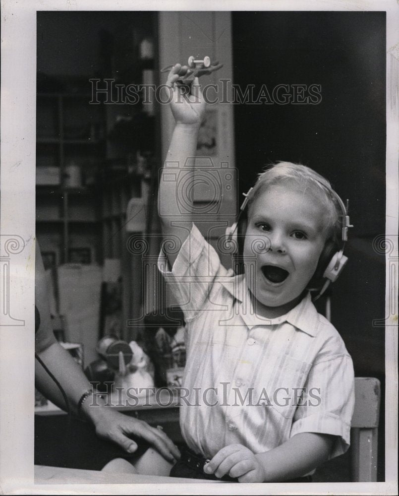 1962 Child With Headphones Teaching Plane - Historic Images