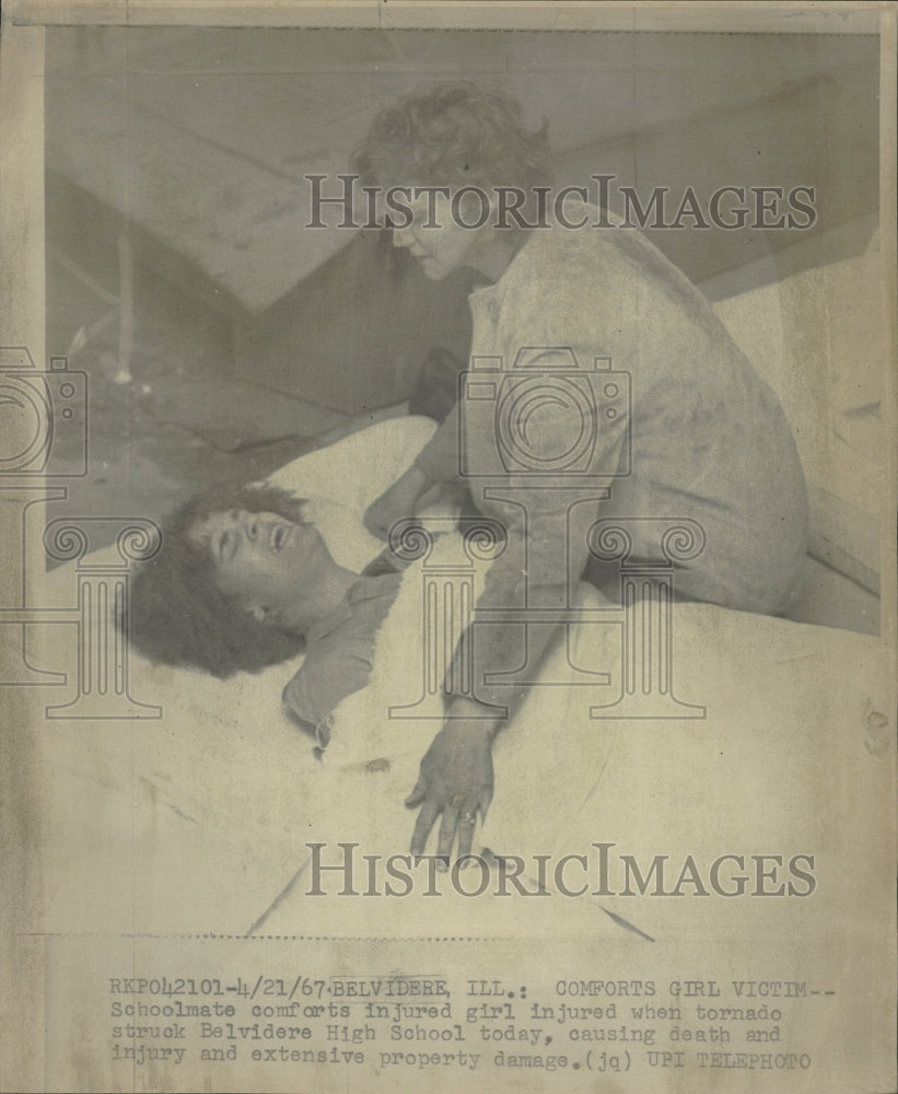 1967 schoolmate comforts injured girl injur - Historic Images