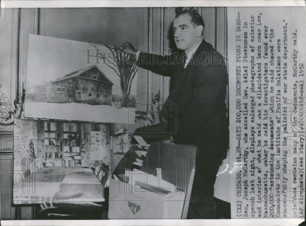 1952 Sen. Joseph McCarthy displays photos - Historic Images