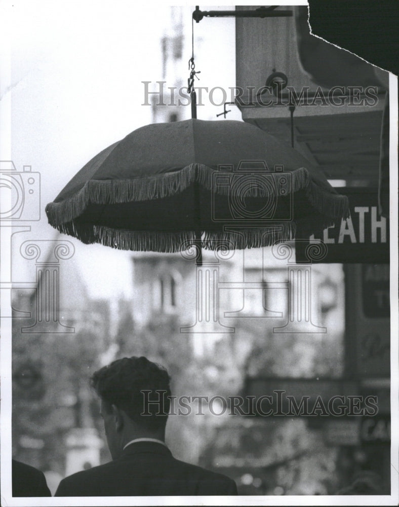 1961 Foul weather Fair Parasol Hangs Shop - Historic Images