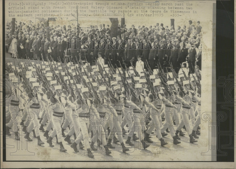 1975 Troops march past official stand - Historic Images