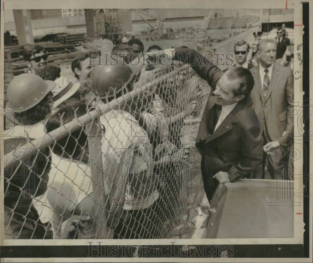 1971 Dixon Reaches to Shake Worker&#39;s Hands - Historic Images