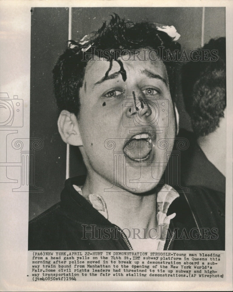 1964 Man hurt in demonistration struggle - Historic Images