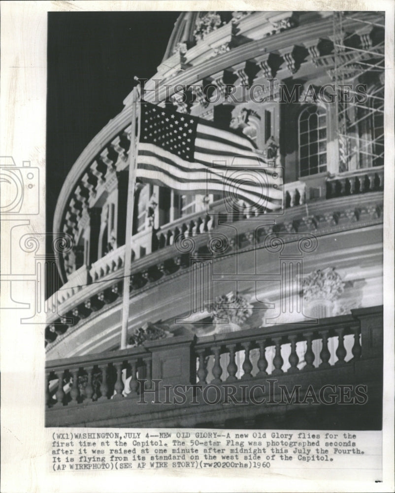 1960 Flag raised at 12:01 AM on 4th of July - Historic Images