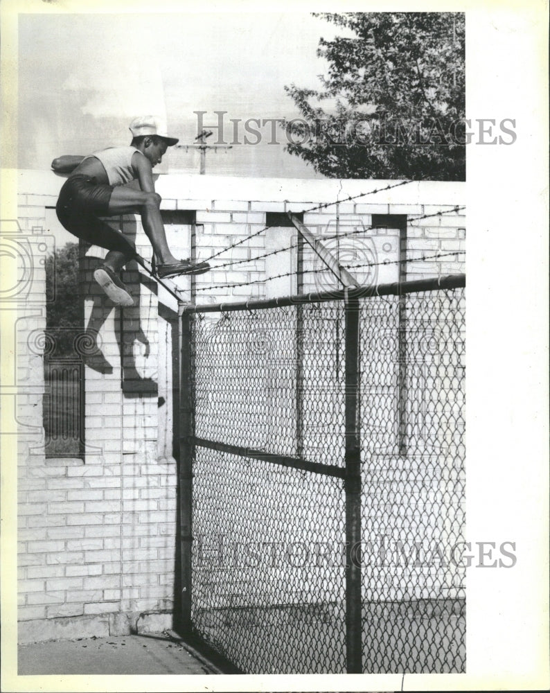 1985 Richard McCord Gary Pool Climb Fence - Historic Images