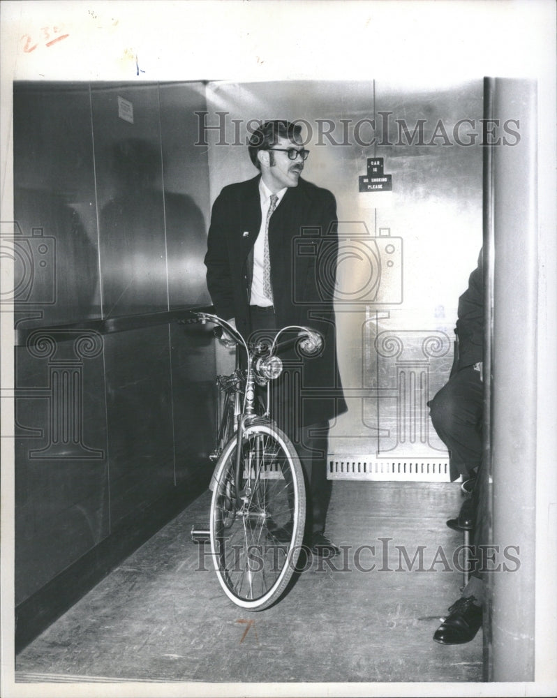 1970 Knack takes bike to work - Historic Images