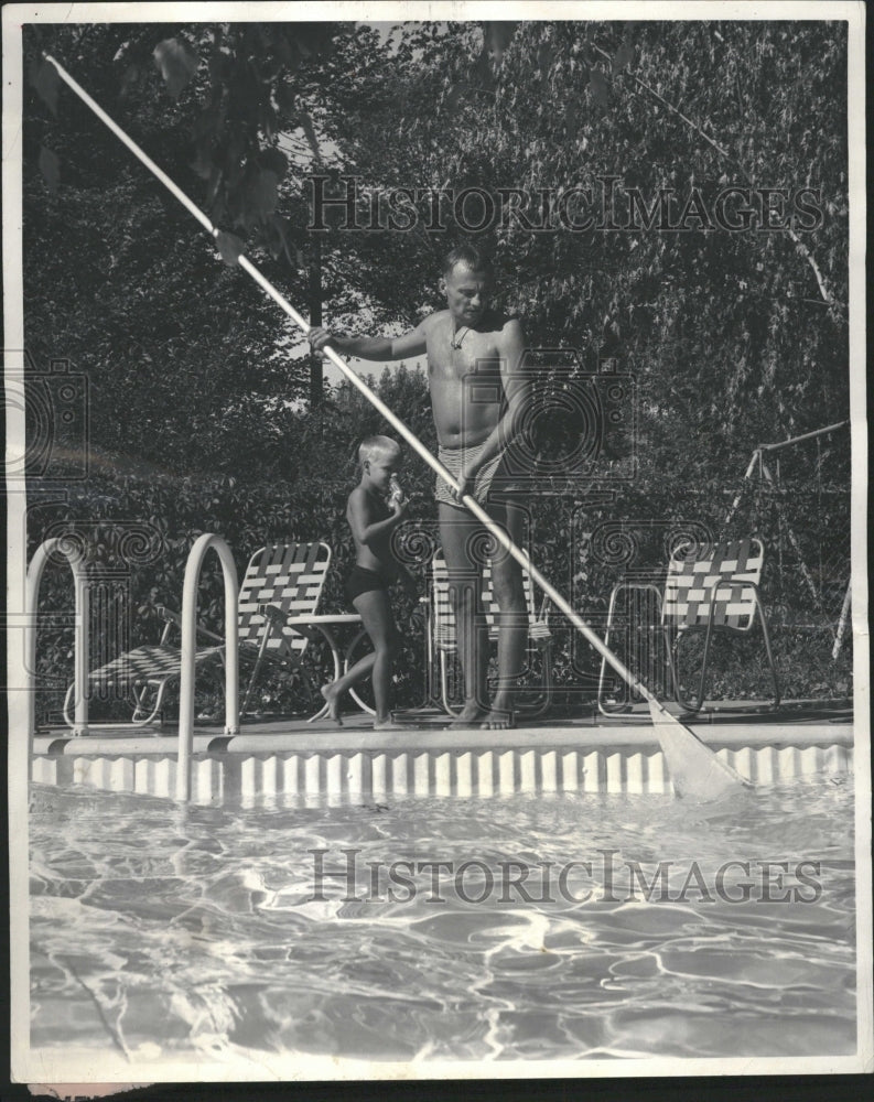 1961 Swimming pool fun and work - Historic Images