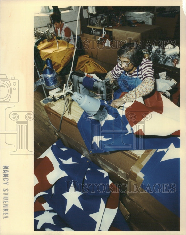 1981 Woman Sewing Flag Street Banner - Historic Images