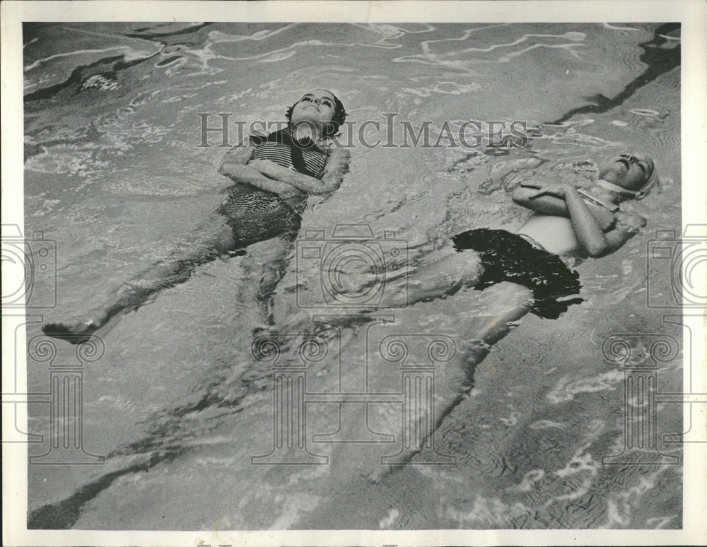 1953 Buoyancy in their suit. - Historic Images