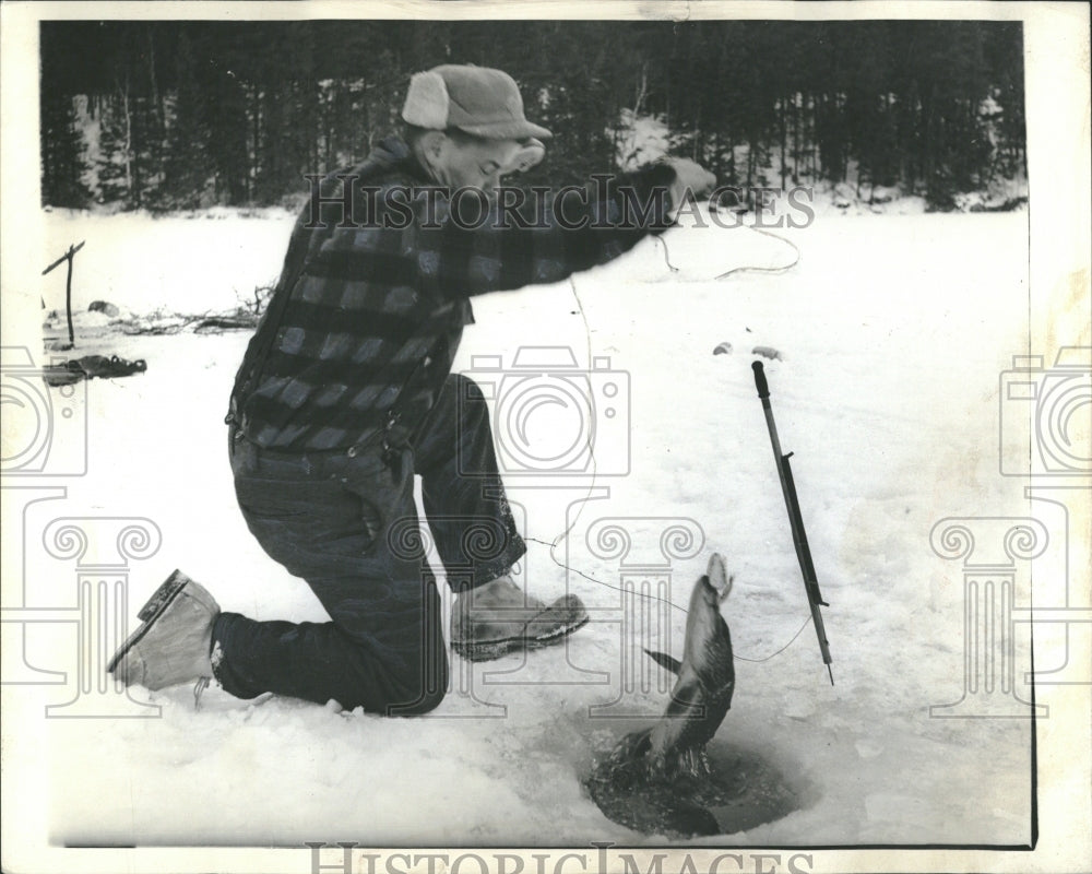 1964 Ely guide Billy Zup northern pike ice - Historic Images