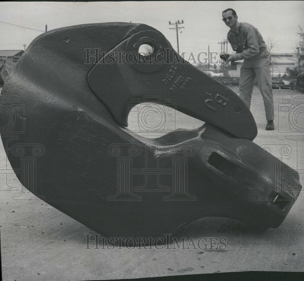 1966 A Giant oil-well rigging hook. - Historic Images