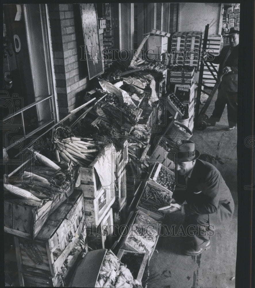 1960 Workers unload 70 varieties of veggies-Historic Images