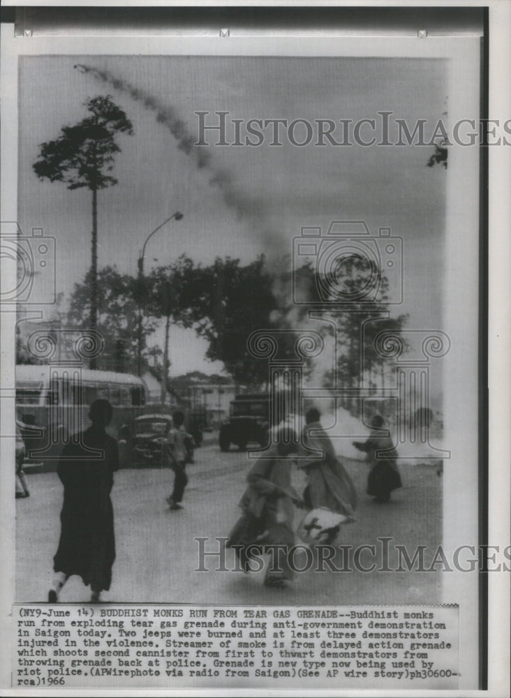 1966 Press Photo Buddhist Monks Run Tear Gas Grenade - Historic Images
