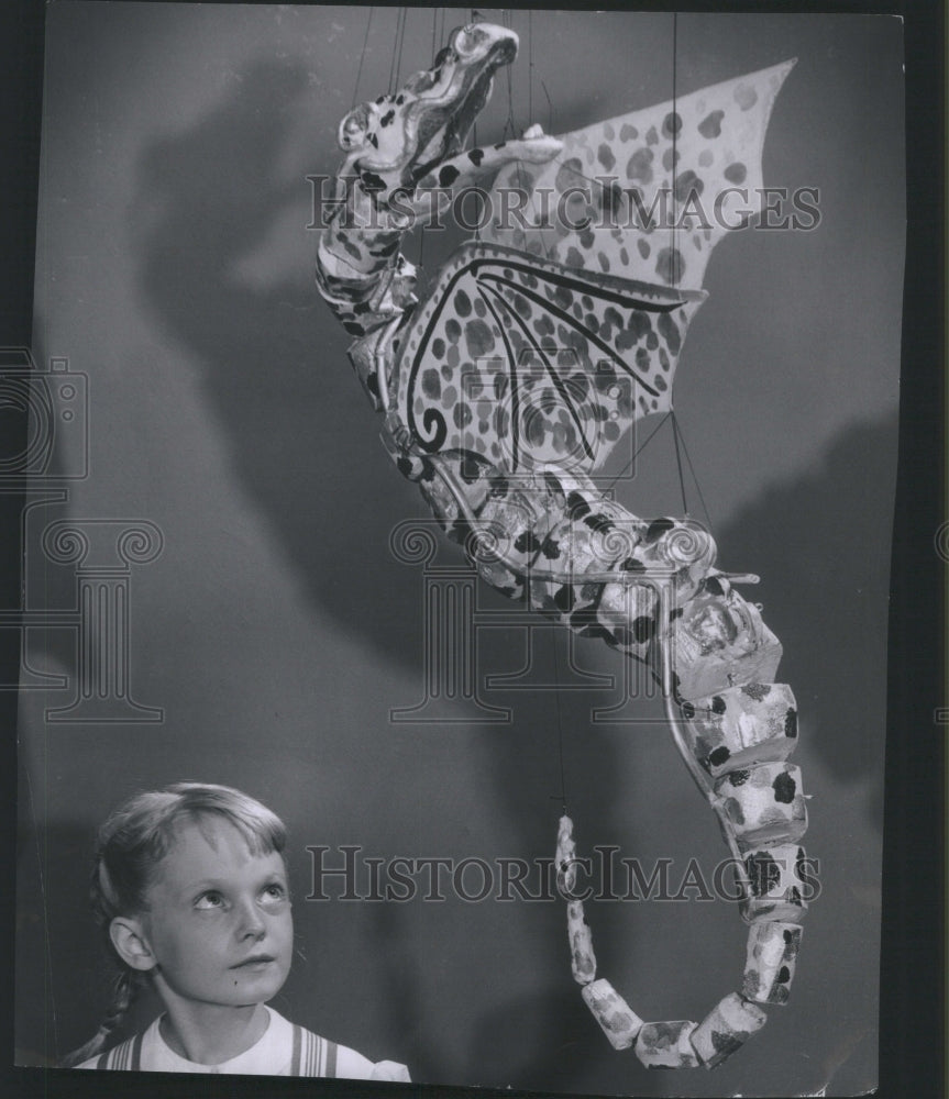 1954, Diane Johnstone watches puppet theater - RRU06803 - Historic Images