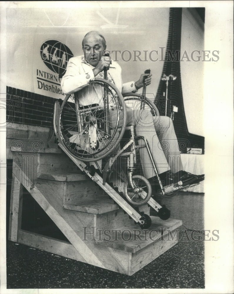 1977, Norman Van Dine Stair Cat Wheelchair - RRU13837 - Historic Images