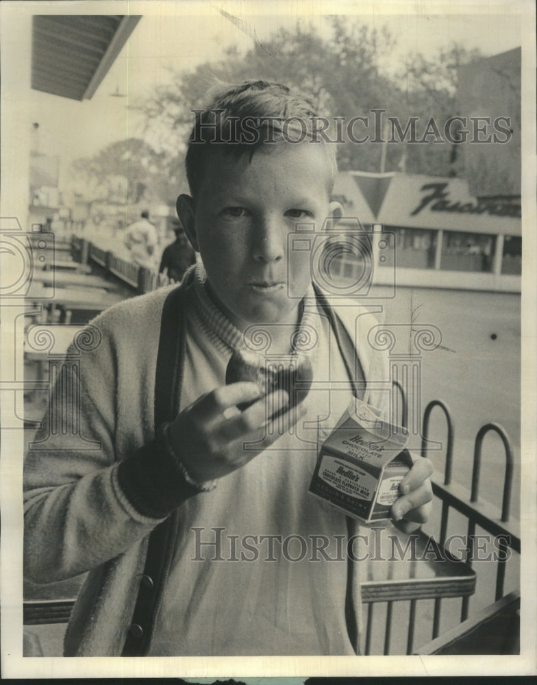 1963, Riverview Park Kid Eating Donut - RRU13925 - Historic Images