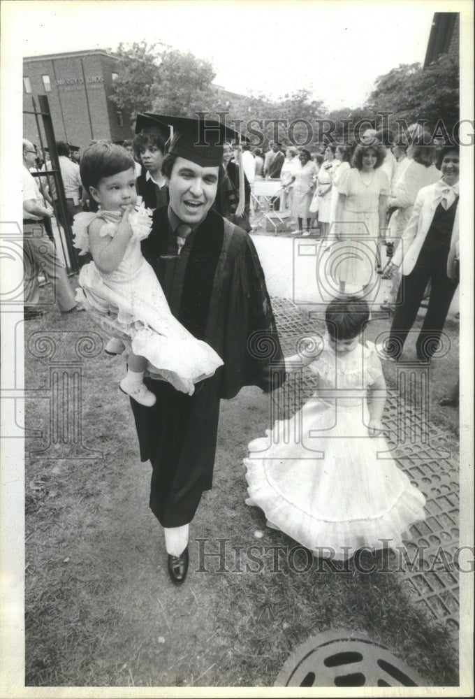 1981, Dad graduates from Med School, w/baby - RRU15429 - Historic Images